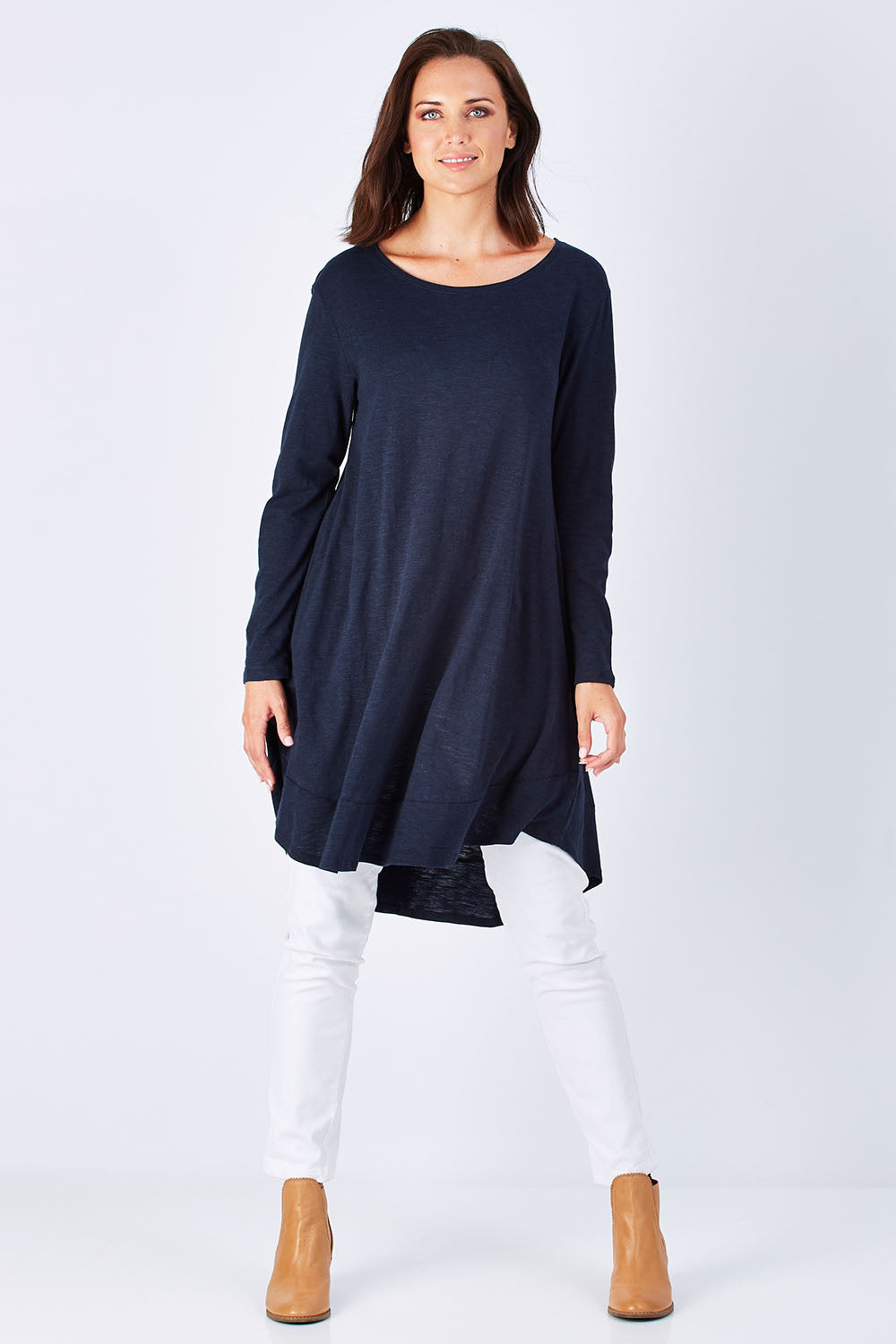 Model Perrie wearing size 10 of The Long Sleeve Swing Dress in colour Navy (Blue), from the front, showing the whole outfit
