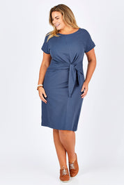 Model Fiona wearing size 16 of The Tie Waist Midi Dress in colour Ink Blue (Blue), from the front, showing the whole outfit