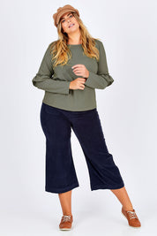 Model Fiona wearing size 16 of The Ruffle Sleeve Sweat in colour KhakiMarle (Green), from the front, showing the whole outfit