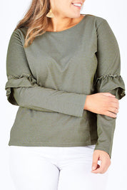Model Natalia wearing size 14 of The Ruffle Sleeve Sweat in colour KhakiMarle (Green), from the front, cropped image