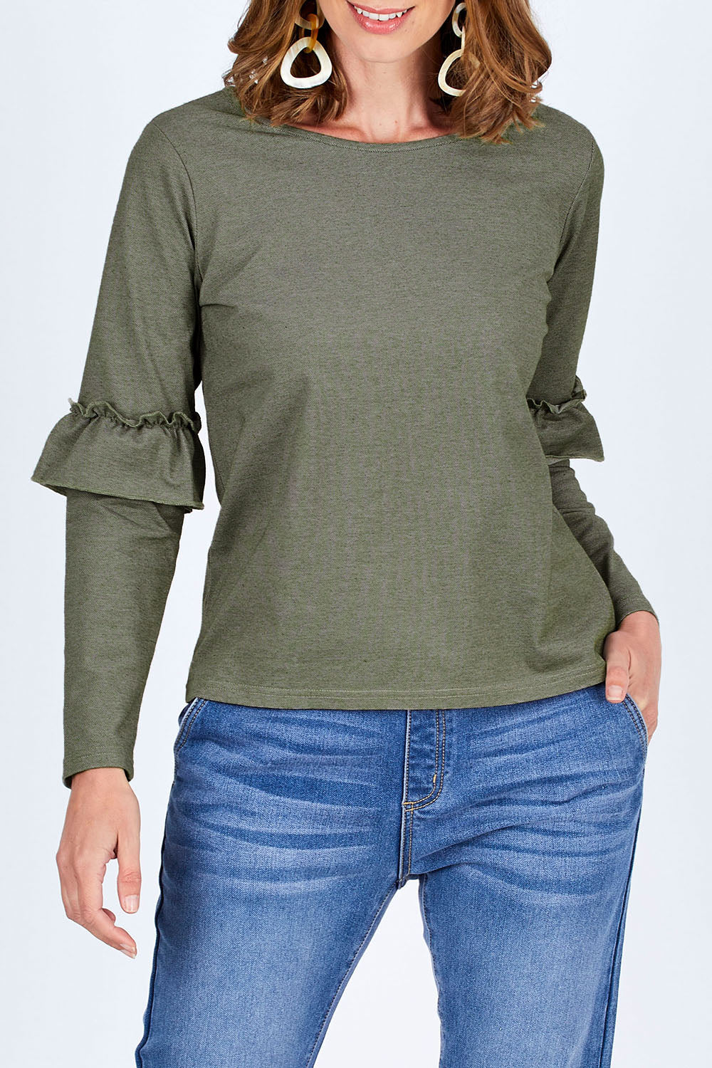 Model Riina wearing size 10 of The Ruffle Sleeve Sweat in colour KhakiMarle (Green), from the front, cropped image