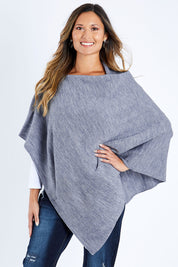 Model Kimberley wearing size S of The Perfect Poncho in colour Bluemarle (Blue), from the front, cropped image