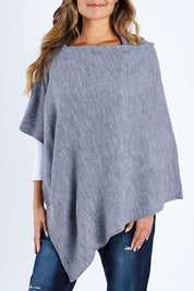Model Kimberley wearing size S of The Perfect Poncho in colour Bluemarle (Blue), from the front, cropped image