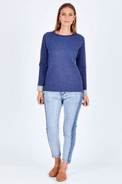Model Riina wearing size 10 of The Step Hem Jean in colour Blue (Blue), from the front, showing the whole outfit