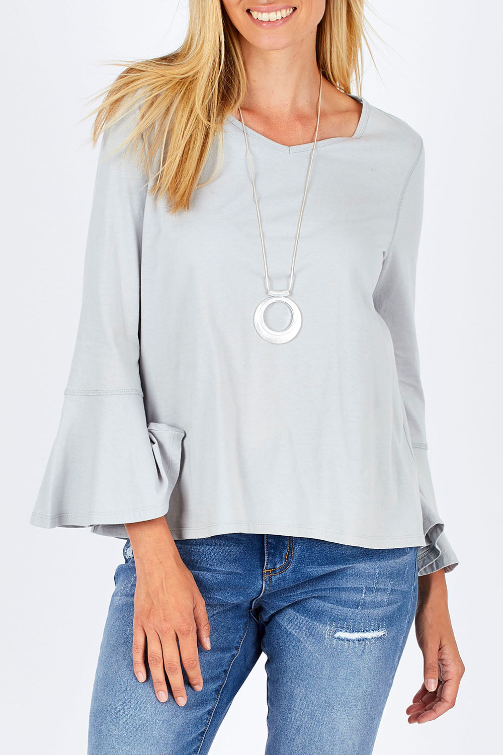 Model Anna wearing size 10 of The Bell Sleeve Top in colour Grey (Grey), from the front, cropped image