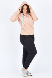 Model Stacey wearing size 12 of The Tie Detail Hoody in colour Pink (Black), from the front, showing the whole outfit