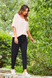 Model Amanda wearing size 10 of The Comfort Pant in colour Black (Black), from the front, showing the whole outfit
