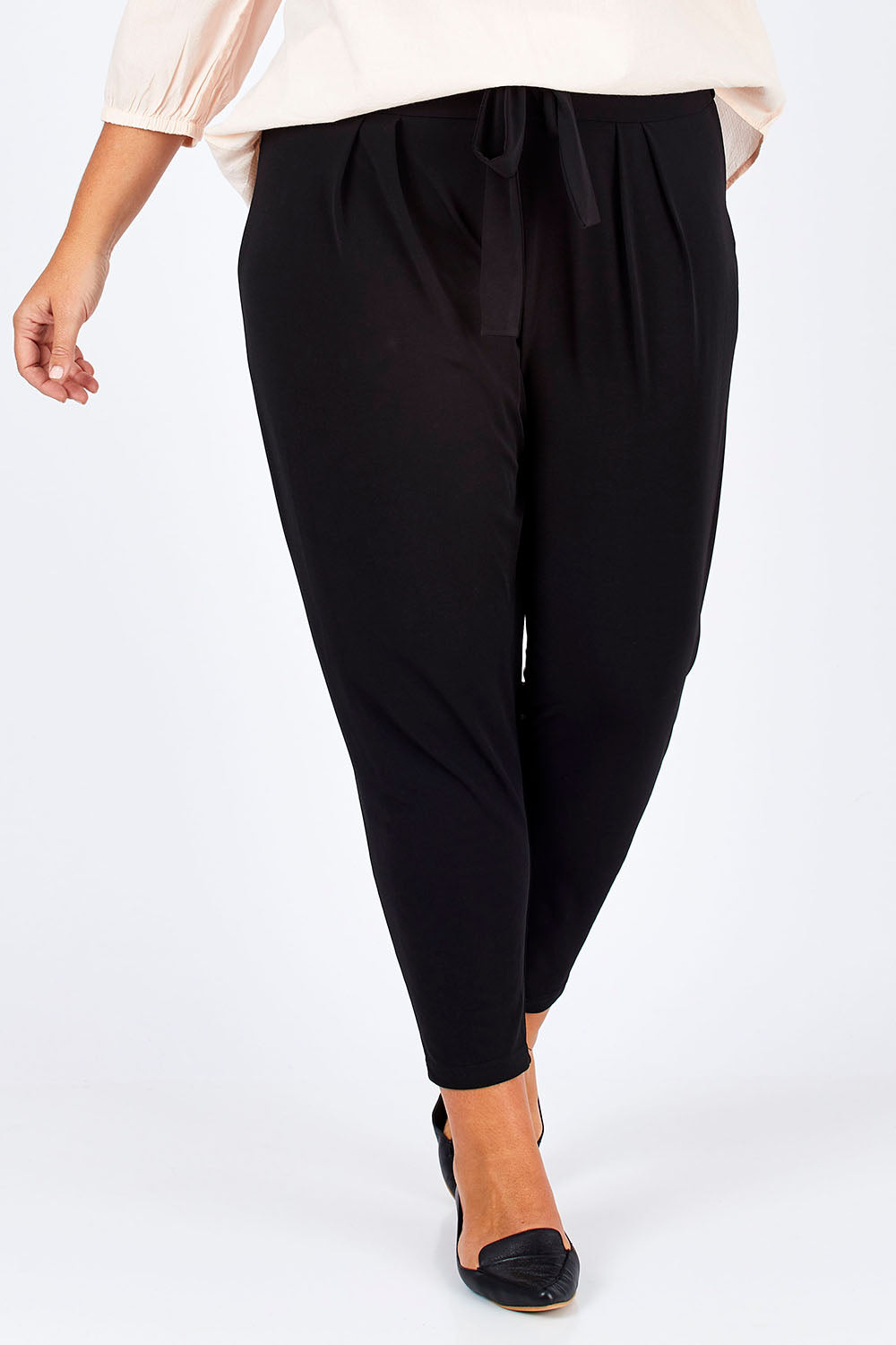 Model Fiona wearing size 16 of The Comfort Pant in colour Black (Black), from the front, cropped image