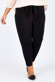 Model Fiona wearing size 16 of The Comfort Pant in colour Black (Black), from the front, cropped image