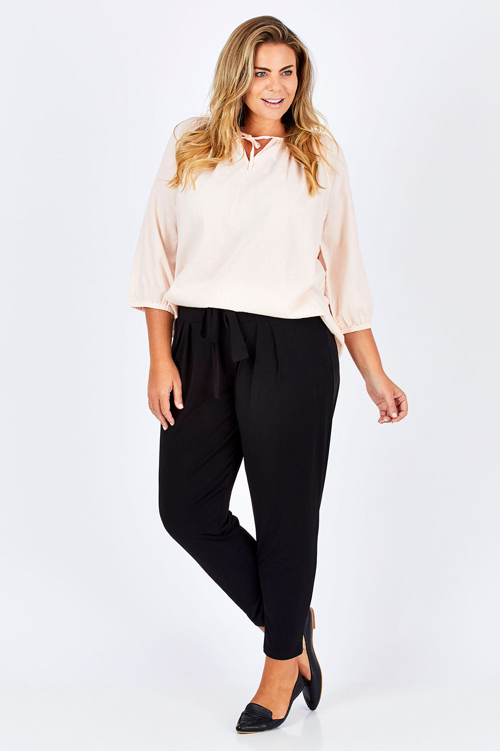 Model Fiona wearing size 16 of The Comfort Pant in colour Black (Black), from the front, showing the whole outfit