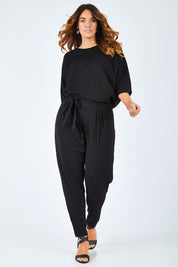 Model Laura wearing size 14 of The Comfort Pant in colour Black (Black), from the front, showing the whole outfit