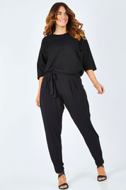 Model Laura wearing size 14 of The Comfort Pant in colour Black (Black), from the front, showing the whole outfit