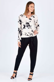 Model Riina wearing size 10 of The Comfort Pant in colour Black (Black), from the front, showing the whole outfit