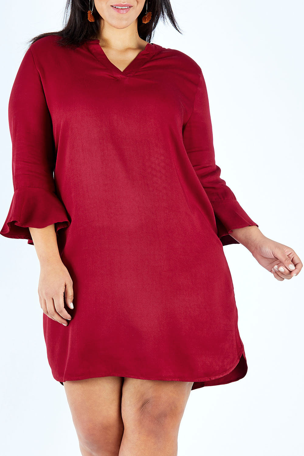 Model Lauren wearing size 18 of The Flute Sleeve Dress in colour Cherry (Red), from the front, cropped image