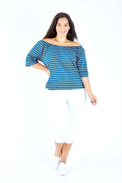 Model Lauren wearing size 18 of The Cotton Bamboo Free Shoulder Top in colour Bluegold (Blue), from the front, showing the whole outfit