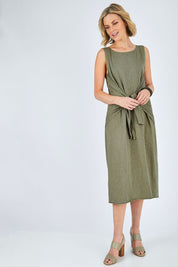 Model Chelsea wearing size 10 of The Tie Waist Tank Dress in colour Khaki (Green), from the front, showing the whole outfit