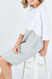 Model Chelsea wearing size 10 of The Spliced Shift Dress in colour Grey (Grey), from the front, cropped image