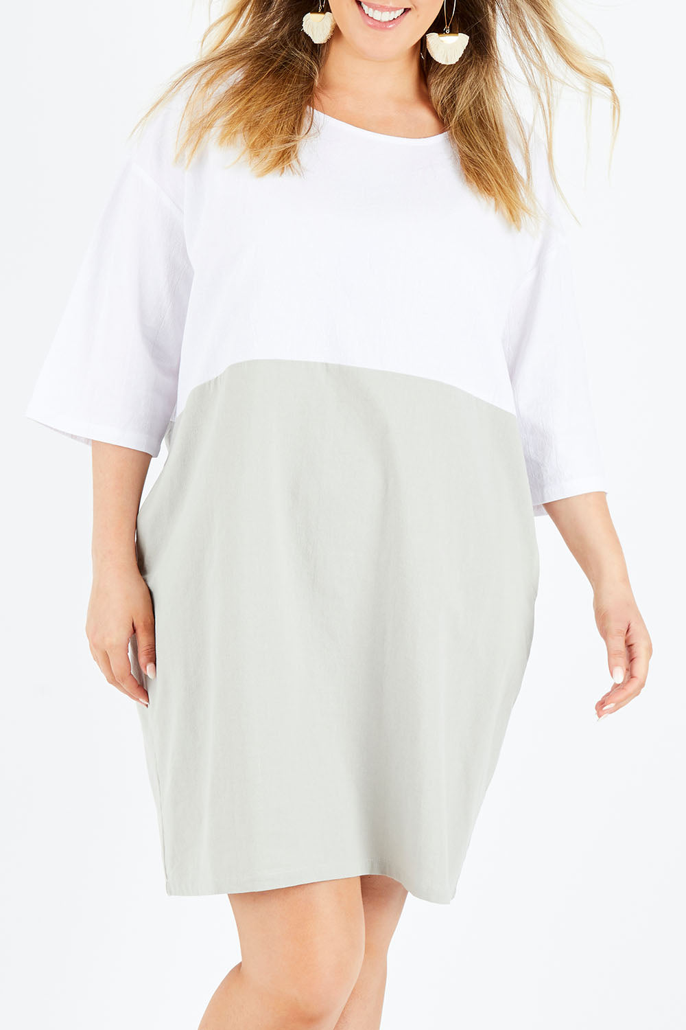 Model Jess wearing size 14 of The Spliced Shift Dress in colour Grey (Grey), from the front, cropped image