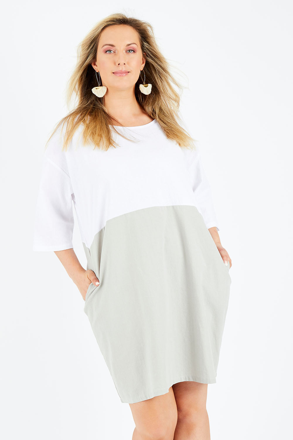 Model Jess wearing size 14 of The Spliced Shift Dress in colour Grey (Grey), from the front, cropped image