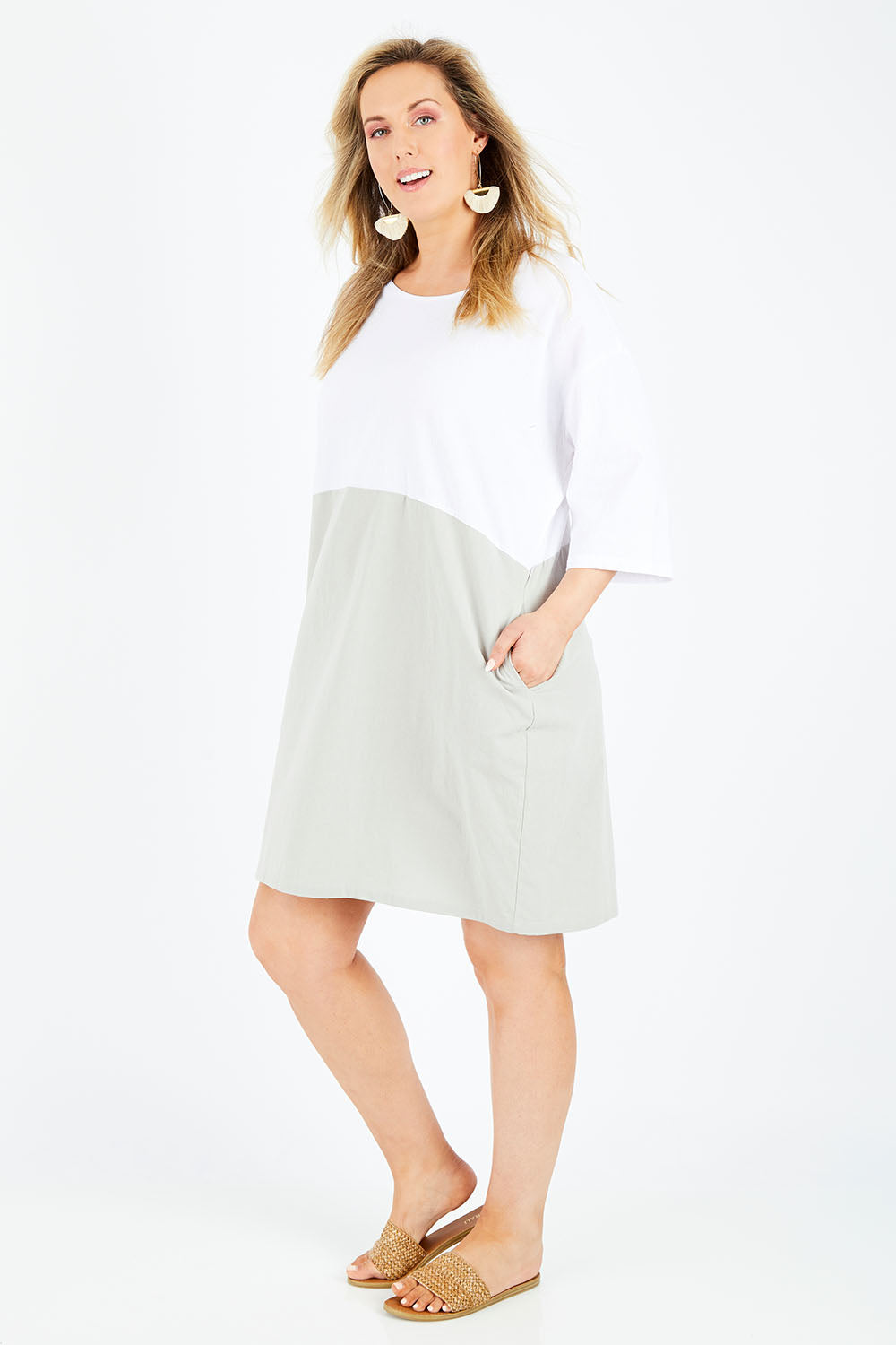 Model Jess wearing size 14 of The Spliced Shift Dress in colour Grey (Grey), from the front, showing the whole outfit