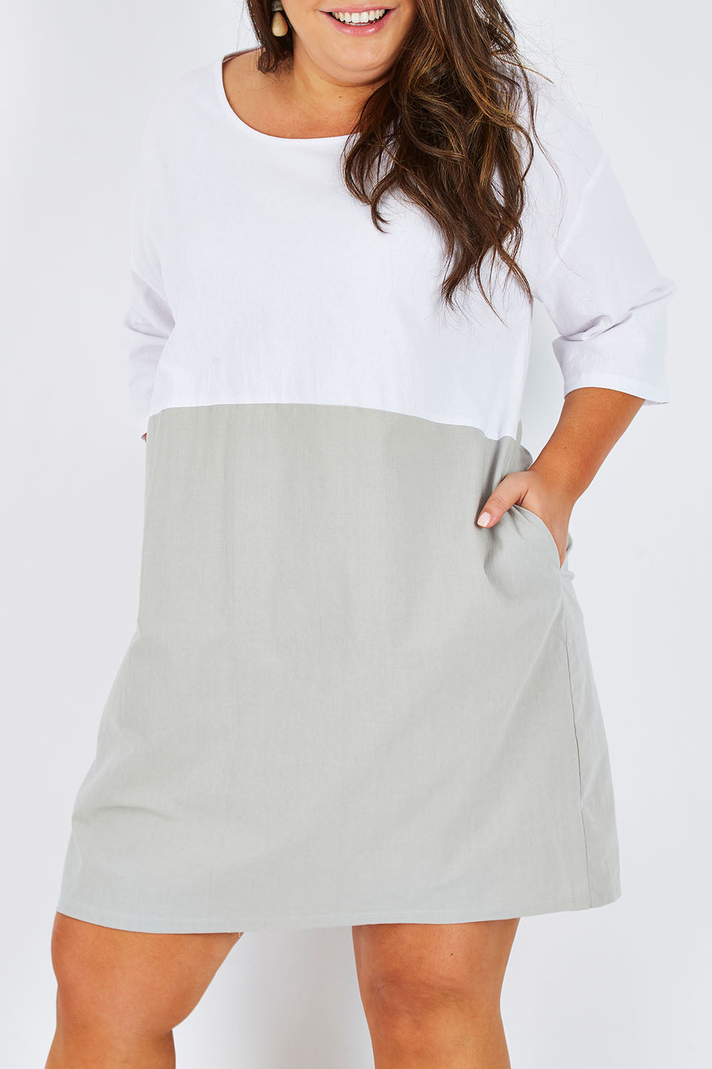 Model Stacey wearing size 16 of The Spliced Shift Dress in colour Grey (Grey), from the front, cropped image