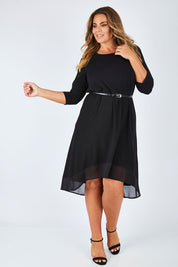 Model Fiona wearing size 16 of The Chiffon Trim Dress in colour Black (Black), from the front, showing the whole outfit