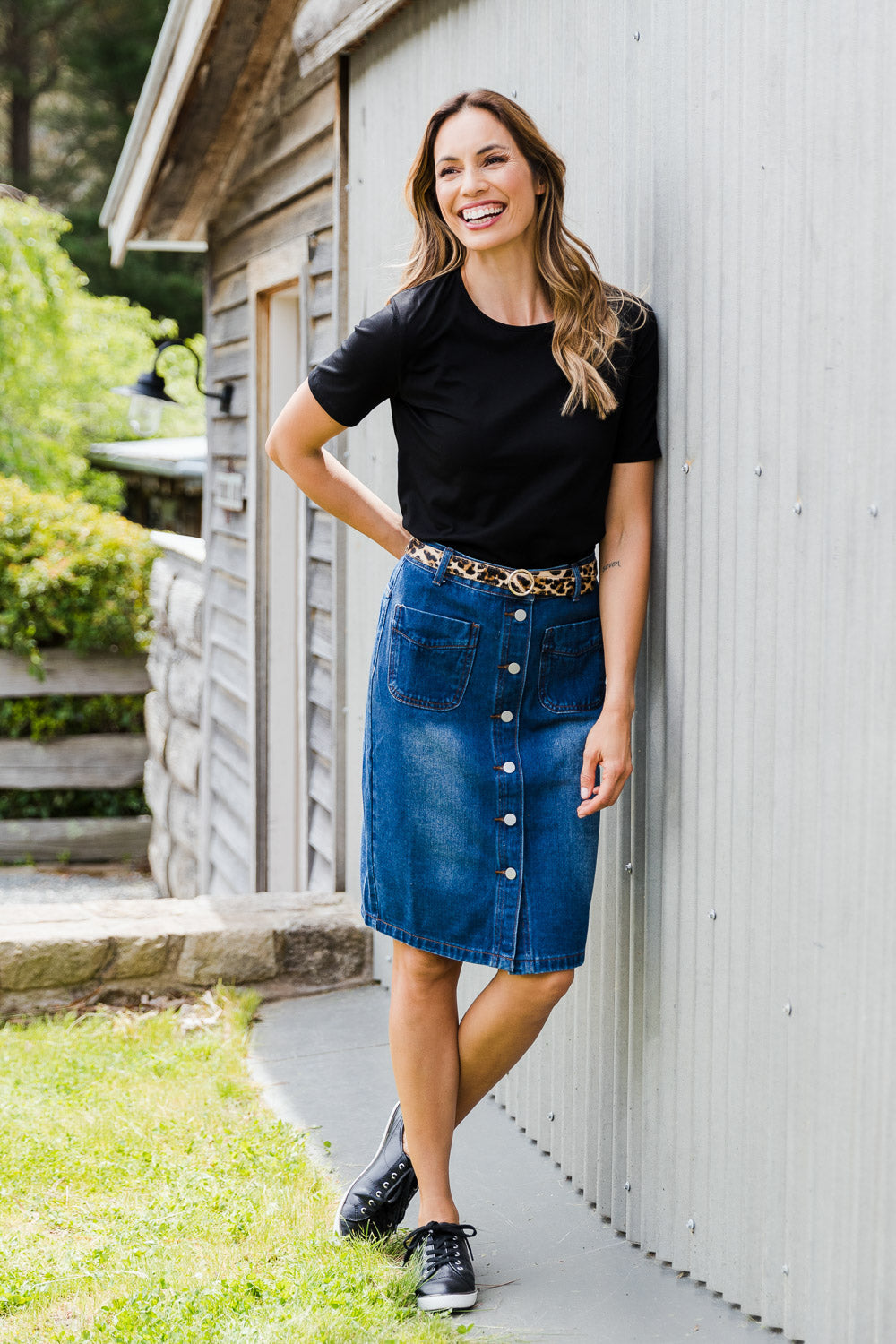 Model Amanda wearing size 10 of The Midi Button Up Skirt in colour Darkdenim (Blue), from the front, showing the whole outfit