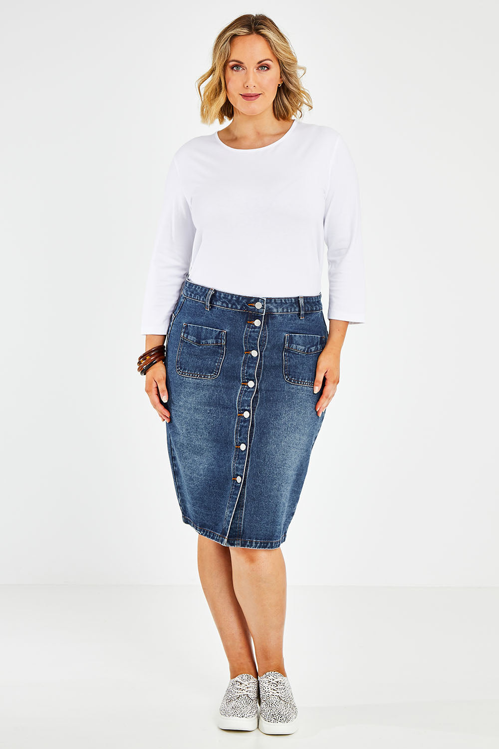 Model Jess wearing size 14 of The Midi Button Up Skirt in colour Darkdenim (Blue), from the front, showing the whole outfit
