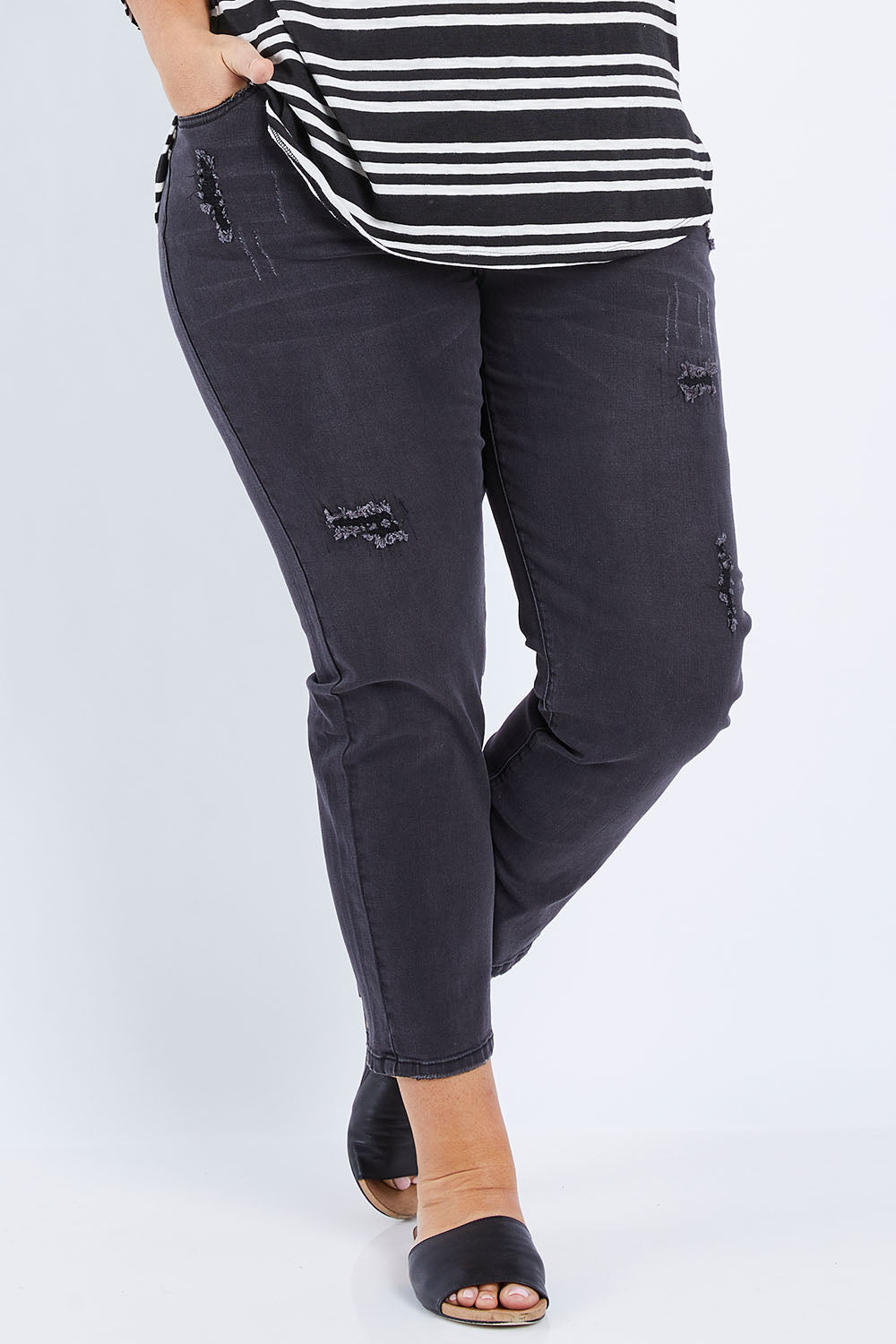 Model Fiona wearing size 16 of The Distressed Boyfriend Jean in colour Black (Black), from the front, cropped image