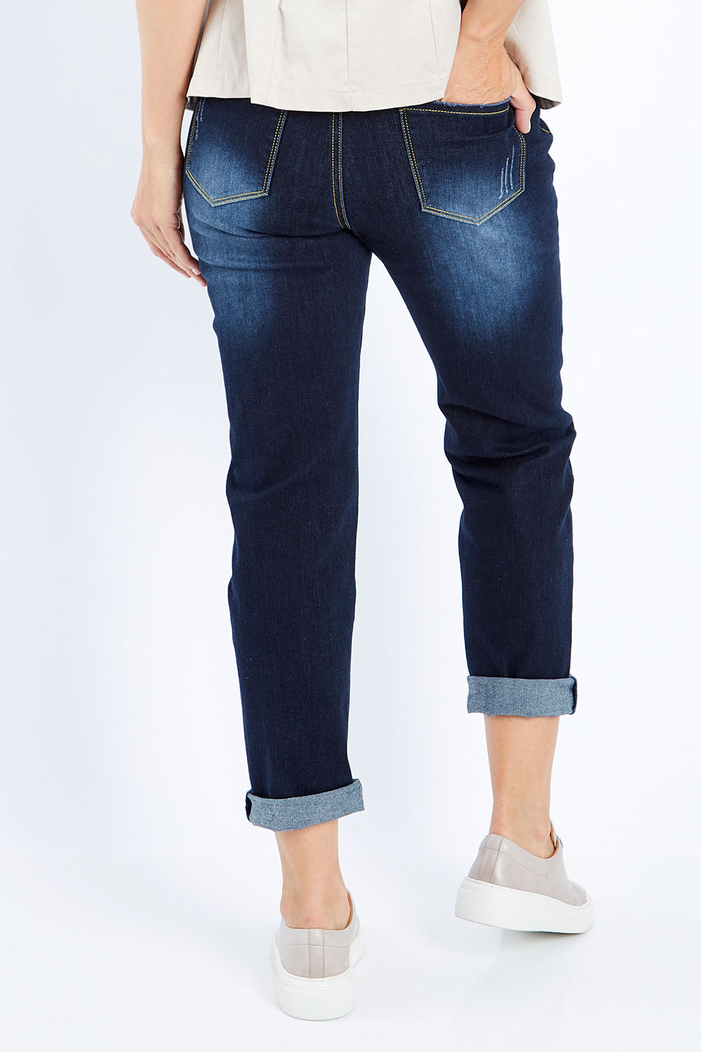 Model Bianca wearing size 10 of The Distressed Boyfriend Jean in colour Darkdenim (Blue), from the back