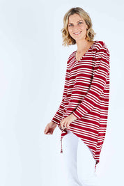 Model Chelsea wearing size 10 of The V Neck Hi Low Top in colour Redstripe (Red), from the front, cropped image