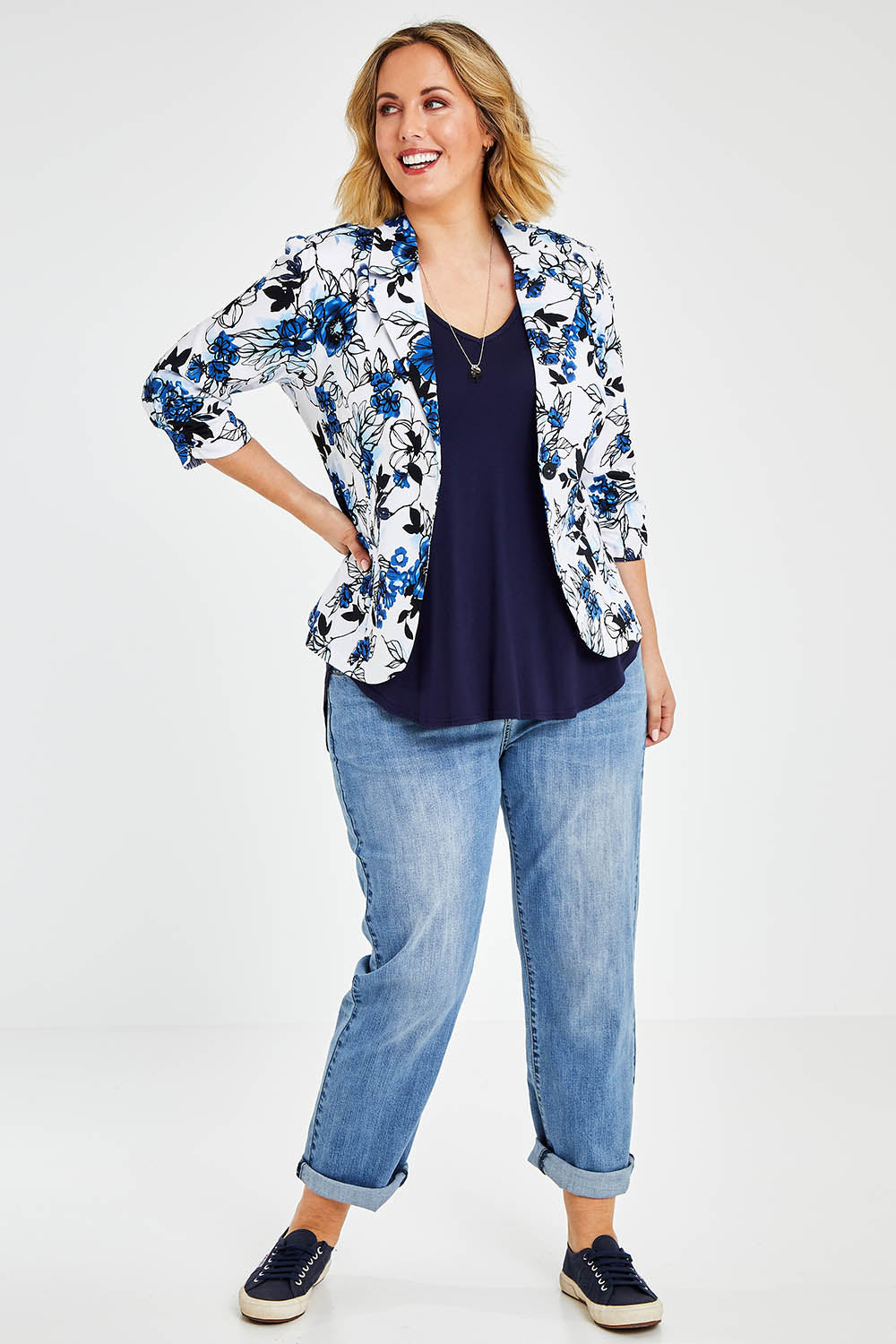 Model Jess wearing size 14 of The Everyday Printed Blazer in colour Bluefloral (Blue), from the front, showing the whole outfit