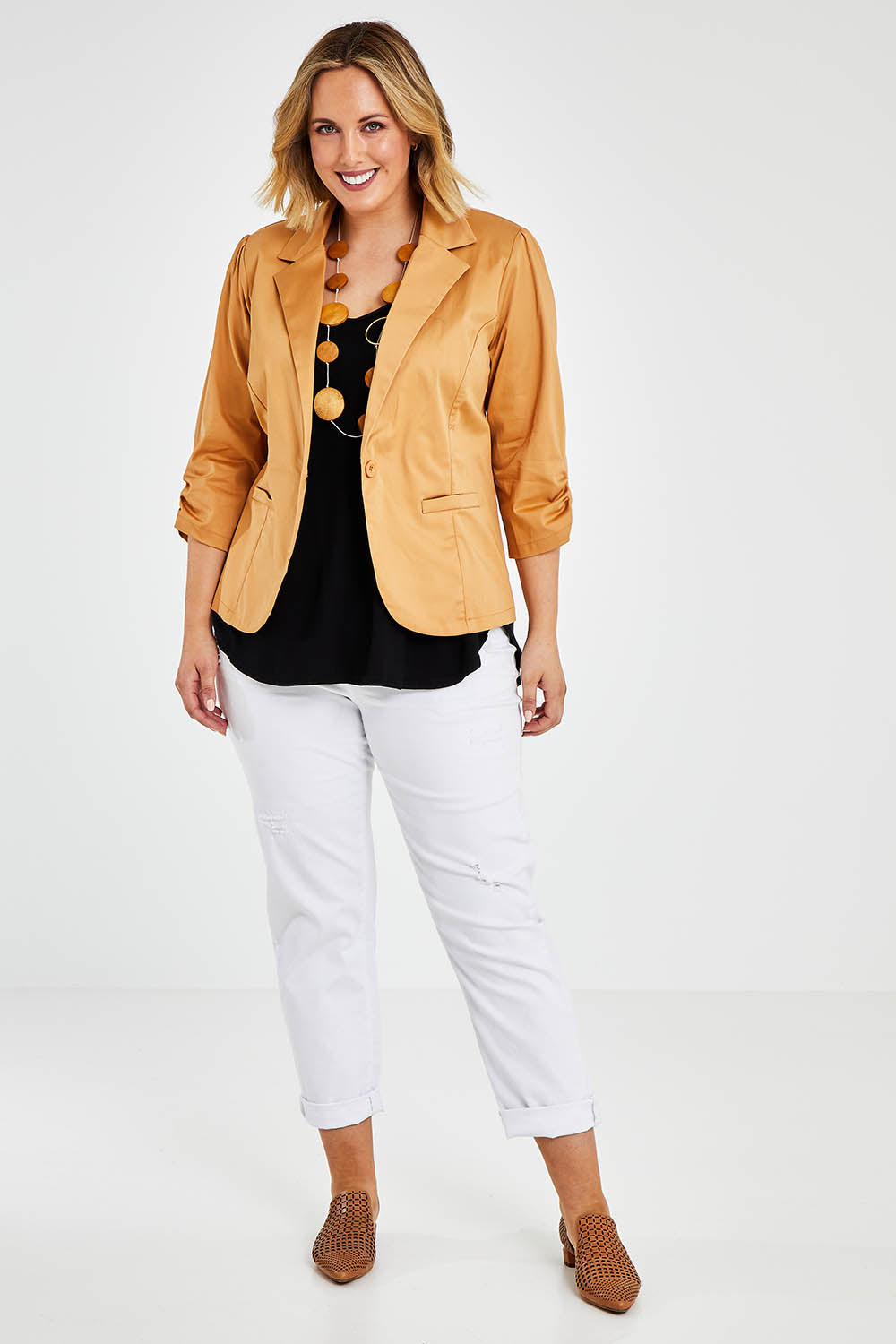 Model Jess wearing size 14 of The Everyday Blazer in colour Camel, from the front, showing the whole outfit