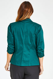 Model Laura wearing size 14 of The Everyday Blazer in colour Deepgreen (Green), from the back