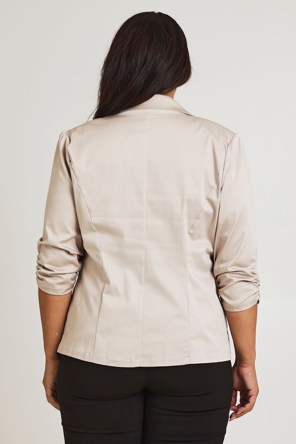 Model Ashleigh wearing size 16 of The Everyday Blazer in colour Stone, from the back