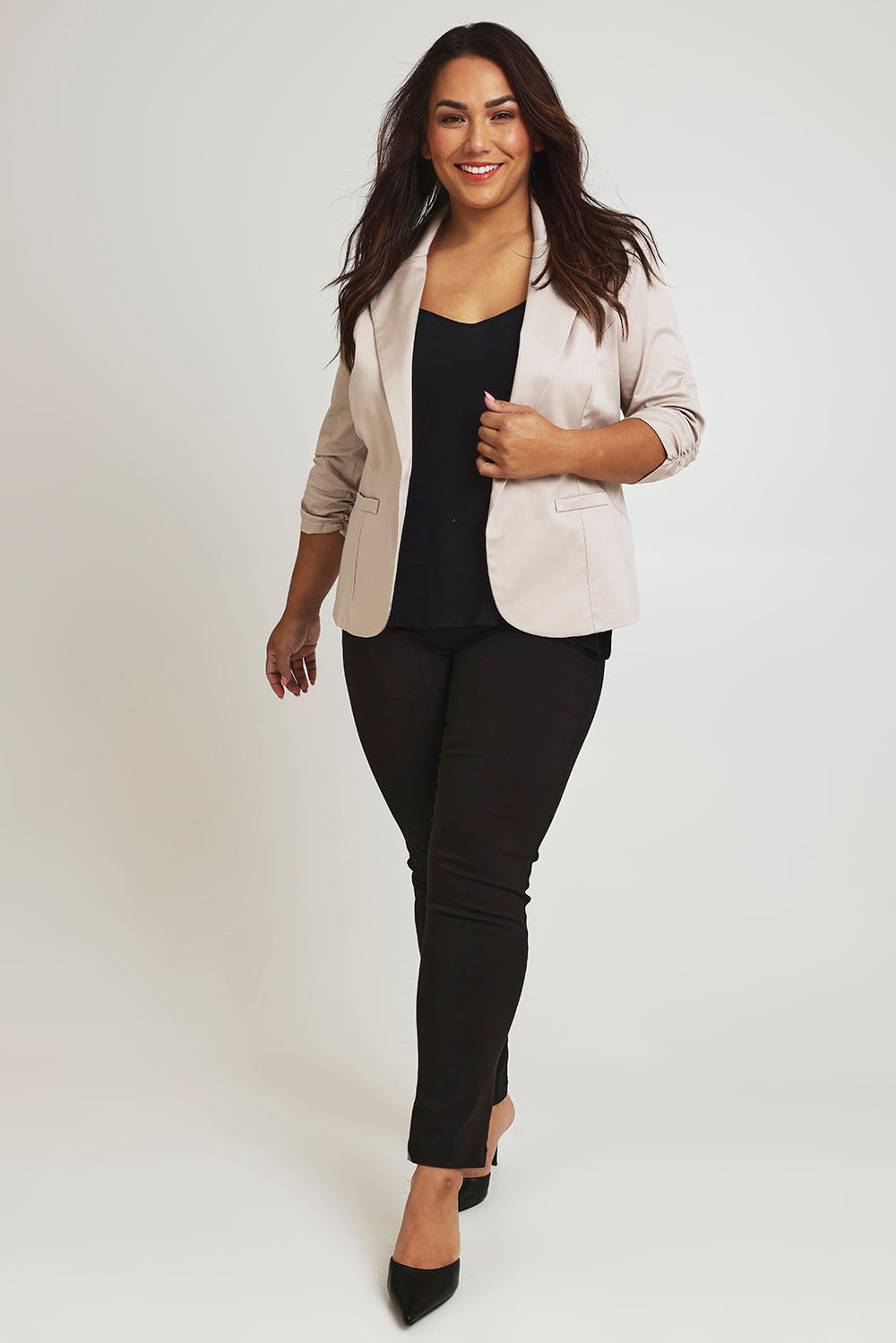 Model Ashleigh wearing size 16 of The Everyday Blazer in colour Stone, from the front, showing the whole outfit