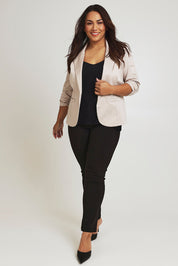 Model Ashleigh wearing size 16 of The Everyday Blazer in colour Stone, from the front, showing the whole outfit