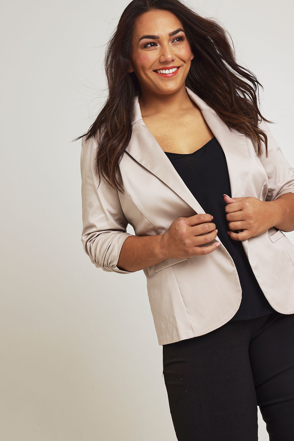 Model Ashleigh wearing size 16 of The Everyday Blazer in colour Stone, from the front, showing the whole outfit