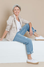 Model Elise wearing size 10 of The Everyday Blazer in colour Stone, from the front, showing the whole outfit