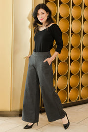 Model Miranda wearing size 10 of The Wide Leg Ponte Pant in colour Darkmarle (Grey), from the front, showing the whole outfit