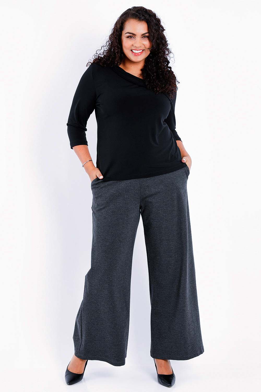 Model Sasha-Lee wearing size 16 of The Wide Leg Ponte Pant in colour Darkmarle (Grey), from the front, showing the whole outfit