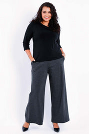 Model Sasha-Lee wearing size 16 of The Wide Leg Ponte Pant in colour Darkmarle (Grey), from the front, showing the whole outfit