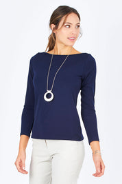 Model Madeline wearing size 10 of The Boat Neck Top in colour Navy (Blue), from the front, cropped image