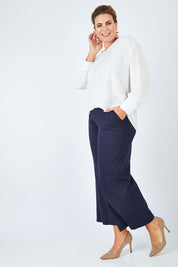 Model Fiona wearing size 16 of The Luxe Dobby Blouse in colour White (White), from the front, showing the whole outfit