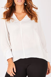 Model Laura wearing size 12 of The Luxe Dobby Blouse in colour White (White), from the front, cropped image