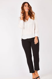 Model Laura wearing size 12 of The Luxe Dobby Blouse in colour White (White), from the front, showing the whole outfit