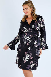 Model Fiona wearing size 16 of The Define Printed Wrap Dress in colour Floral (Black), from the front, cropped image