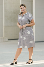 Model Fiona wearing size 16 of The Cotton Blend Button Front Dress in colour Spotstripe (Black), from the front, showing the whole outfit