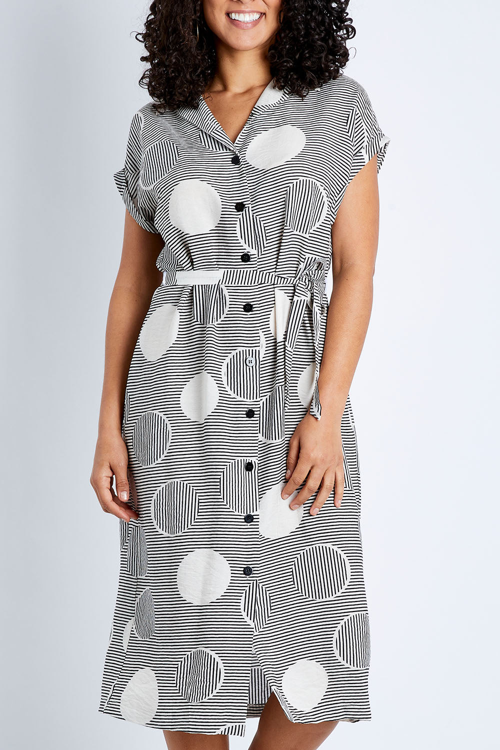 Model Pamela wearing size 10 of The Cotton Blend Button Front Dress in colour Spotstripe (Black), from the front, cropped image