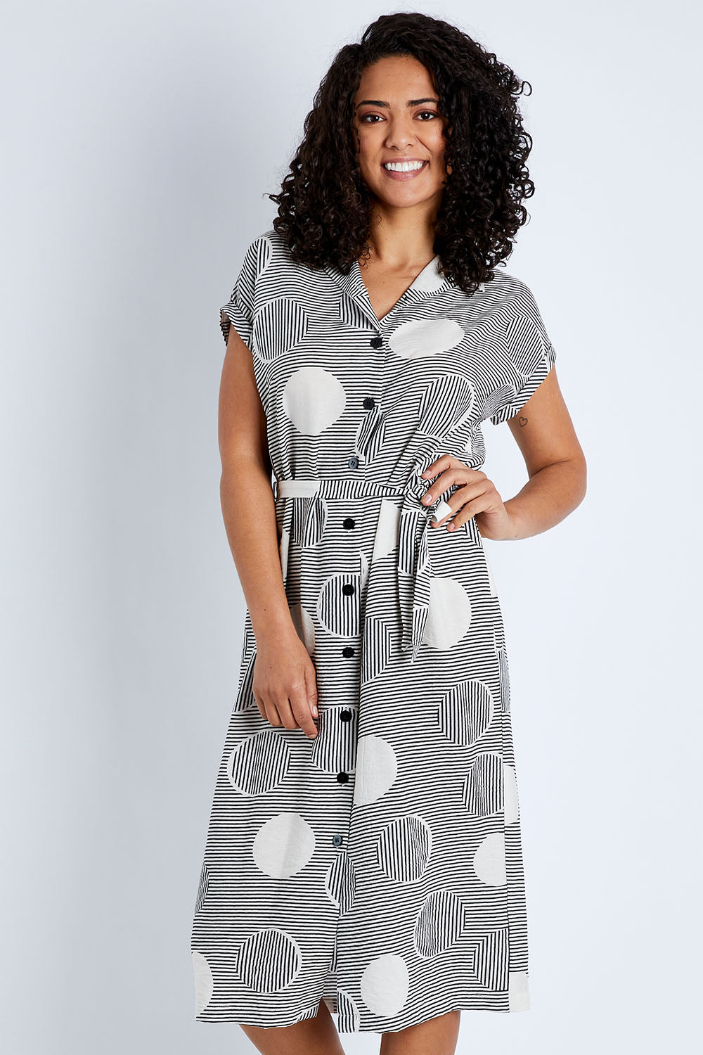 Model Pamela wearing size 10 of The Cotton Blend Button Front Dress in colour Spotstripe (Black), from the front, cropped image